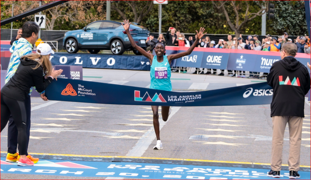 LA Marathon Meringot Crossing The Finish Line